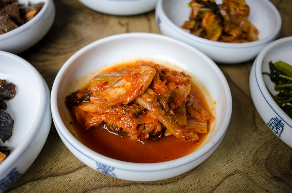 Photo by makafood Close-up of flavorful Korean kimchi served in a traditional dish.