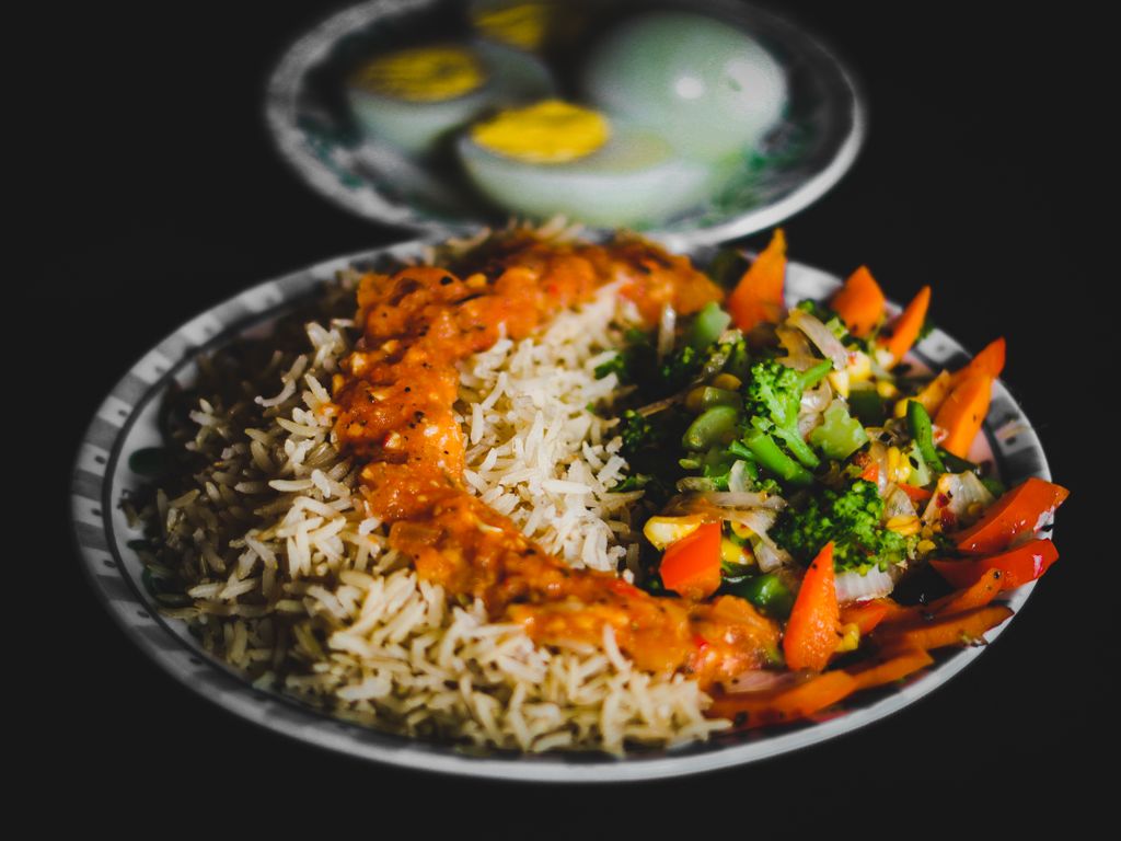 Photo by Pixel Senses Delicious Indian rice dish with vegetables and eggs highlighting traditional flavors.
