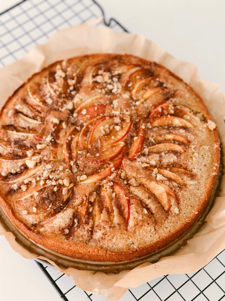 Delicious homemade apple cinnamon cake with walnuts, perfect for autumn treats.